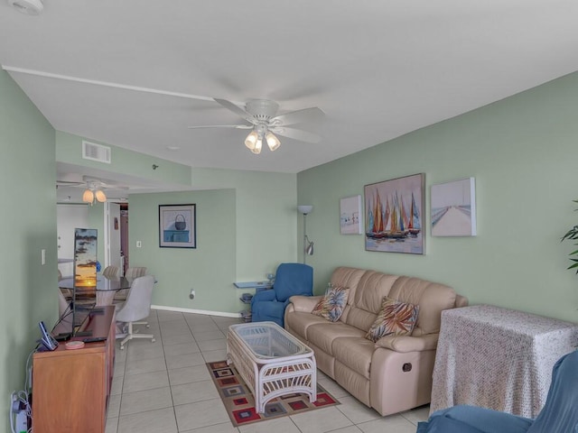 tiled living room featuring ceiling fan