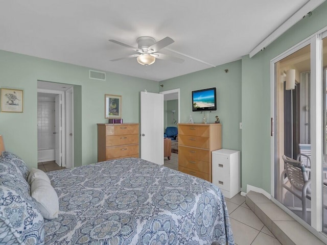 tiled bedroom featuring ceiling fan and ensuite bathroom