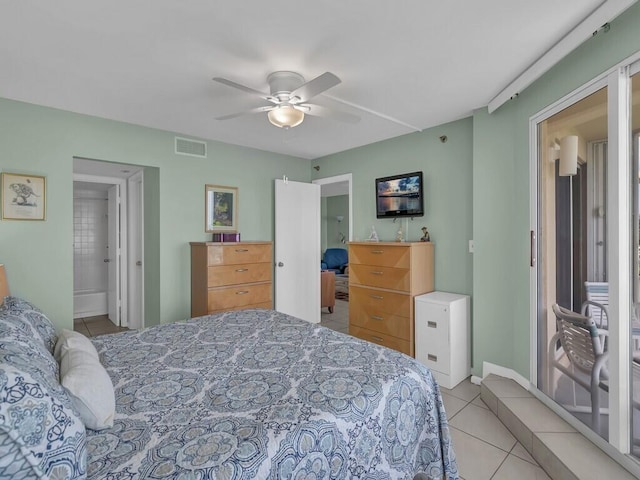 tiled bedroom with ensuite bathroom and ceiling fan