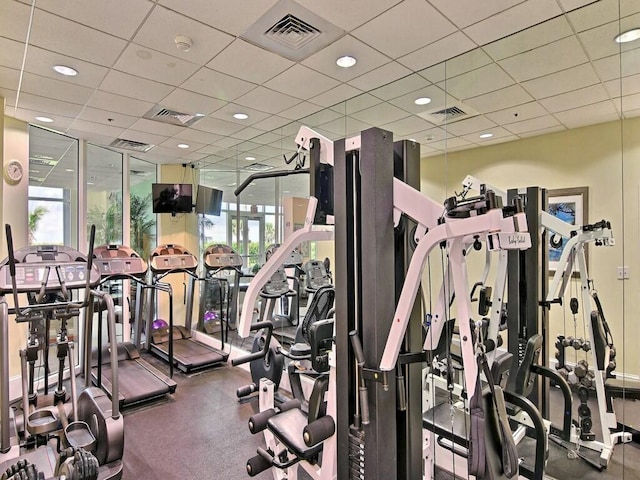 workout area featuring a paneled ceiling