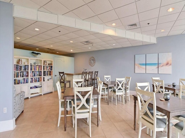 dining area featuring light tile patterned floors