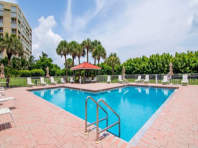 view of swimming pool with a patio