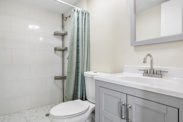 bathroom with curtained shower, vanity, and toilet