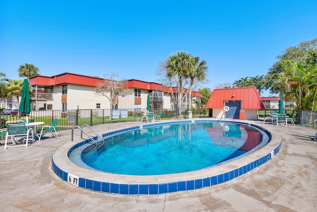 view of swimming pool featuring a patio