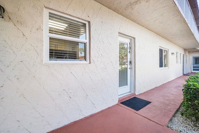 entrance to property featuring a patio