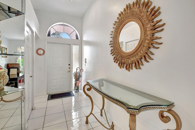 entrance foyer featuring a high ceiling and light tile patterned floors