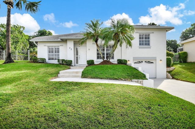 view of front of home featuring a garage and a front lawn