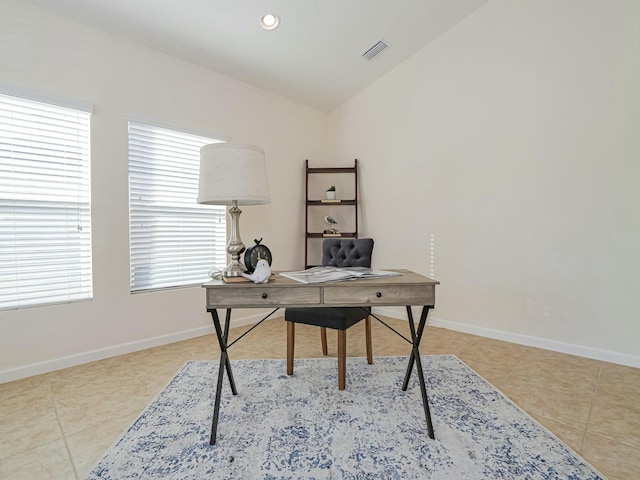 tiled office space with lofted ceiling