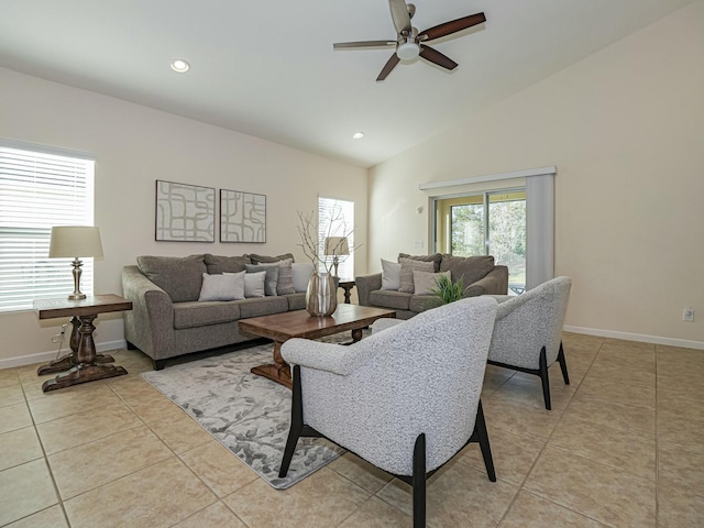 living room featuring light tile patterned floors, vaulted ceiling, and ceiling fan