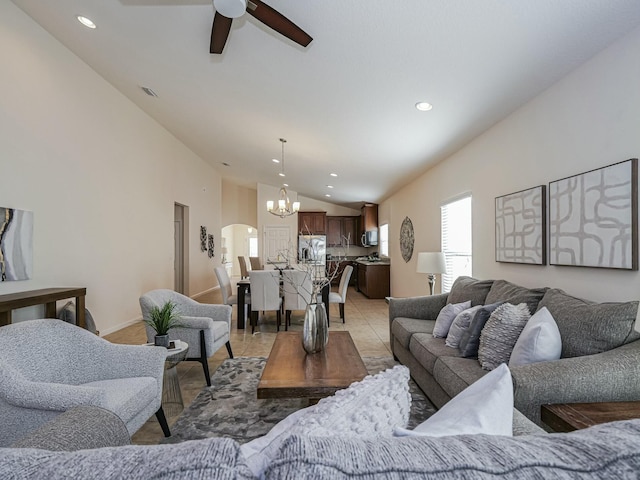 living room with light tile patterned floors, ceiling fan with notable chandelier, and lofted ceiling