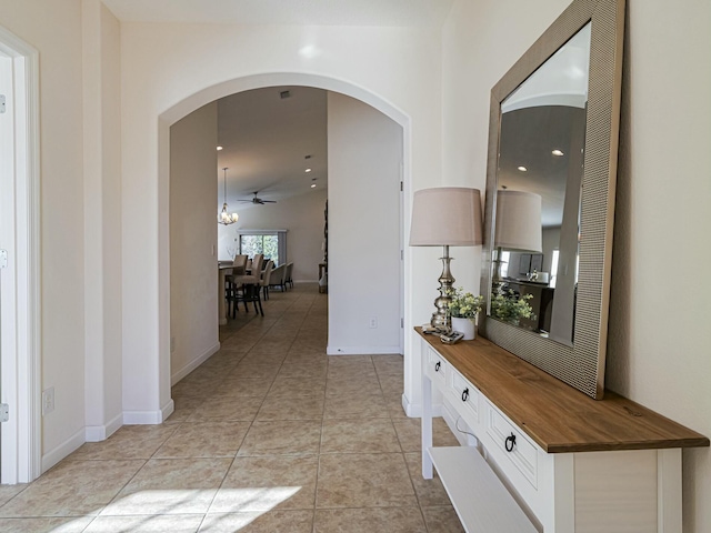 hall with light tile patterned floors