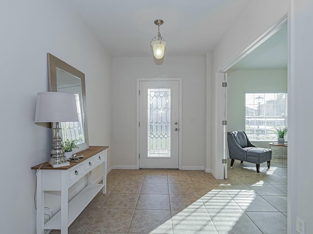 foyer entrance featuring light tile patterned flooring