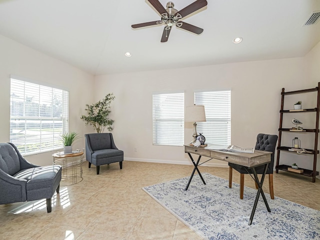 tiled office space featuring ceiling fan