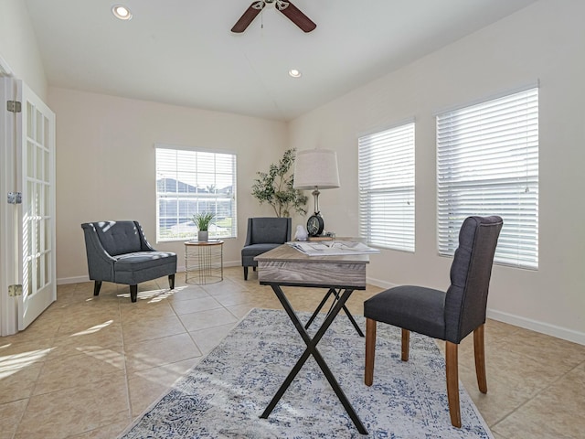 office area featuring vaulted ceiling, a wealth of natural light, ceiling fan, and light tile patterned floors