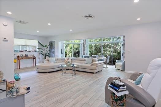 living room featuring light hardwood / wood-style floors and a healthy amount of sunlight