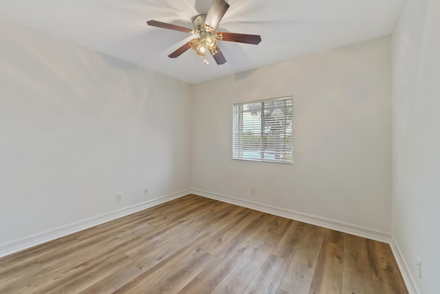 empty room featuring light hardwood / wood-style flooring and ceiling fan