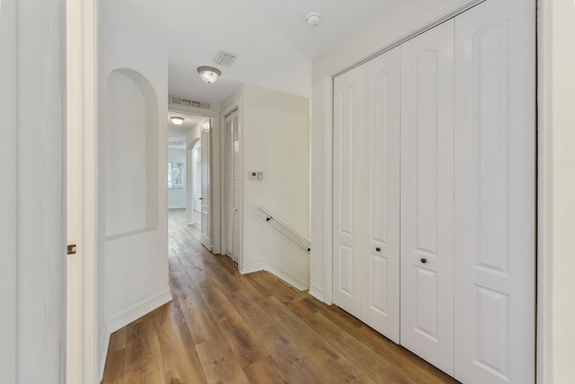 hall with light hardwood / wood-style floors