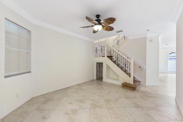 unfurnished living room featuring ornamental molding, light tile patterned floors, and ceiling fan