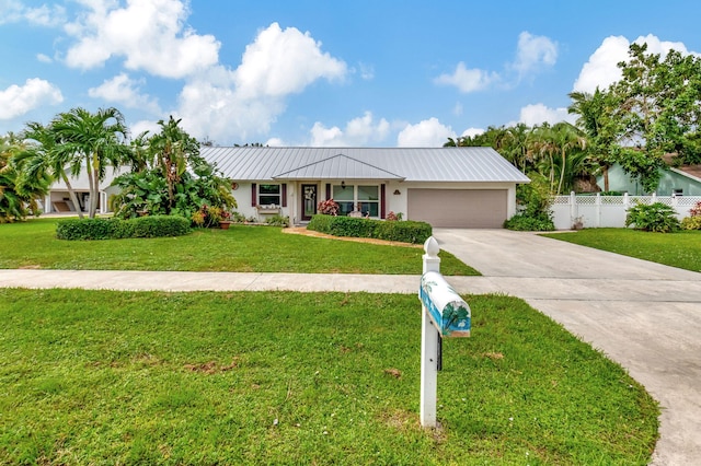 ranch-style home with a front yard and a garage