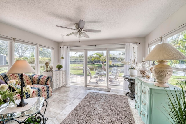 living room featuring a healthy amount of sunlight and a textured ceiling