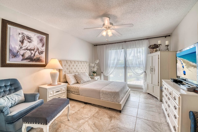 bedroom featuring a textured ceiling and ceiling fan