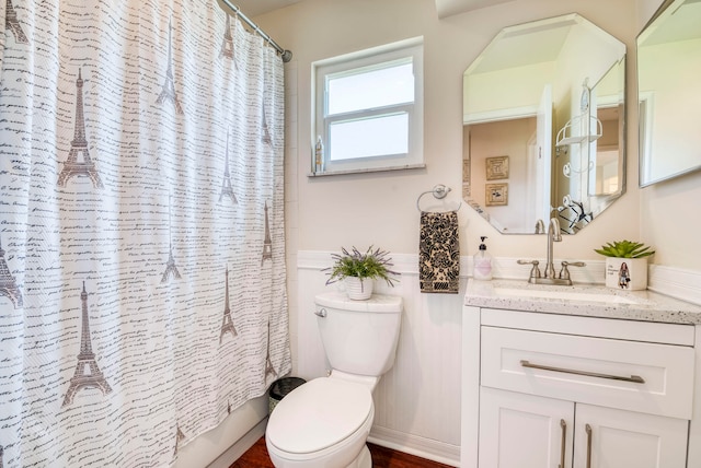 full bathroom with toilet, shower / tub combo, and vanity