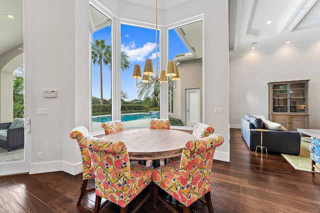 dining space with beam ceiling, a healthy amount of sunlight, dark wood-type flooring, and ornamental molding