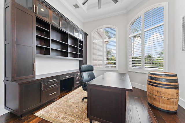 home office with a wealth of natural light, crown molding, and dark hardwood / wood-style floors