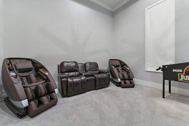 home theater room with crown molding and light carpet