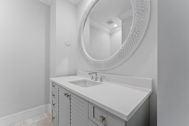 bathroom featuring vanity and crown molding