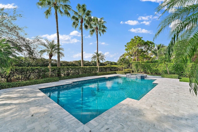 view of pool featuring an in ground hot tub and a patio