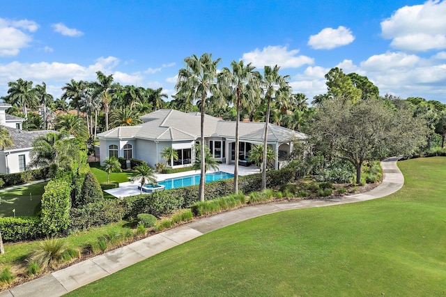 view of pool with a yard