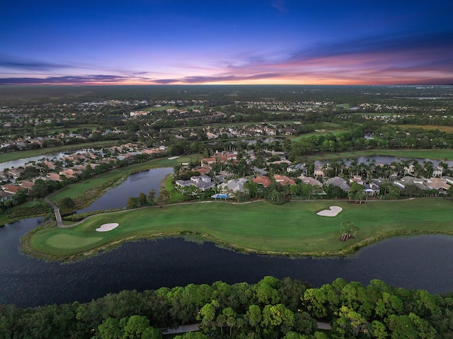 aerial view at dusk with a water view