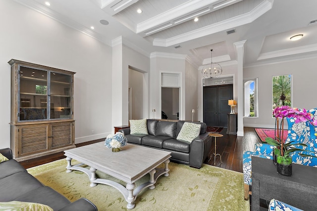 living room featuring beam ceiling, coffered ceiling, crown molding, hardwood / wood-style floors, and a chandelier