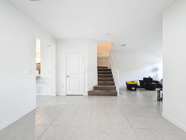 stairs with tile patterned flooring