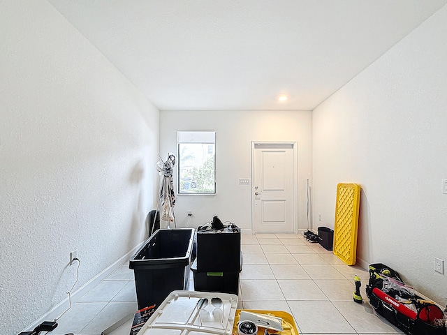 miscellaneous room featuring light tile patterned floors