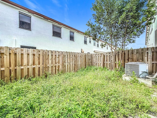 view of yard with central AC unit