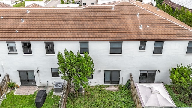 rear view of property with central air condition unit