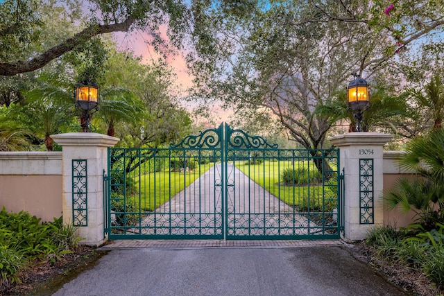 view of gate at dusk