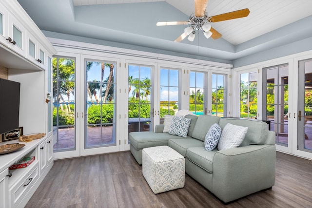 sunroom / solarium with a tray ceiling, ceiling fan, and french doors