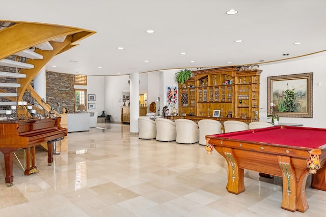 playroom with pool table and indoor bar