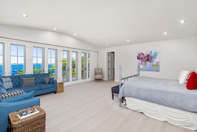 bedroom featuring a water view, access to exterior, light colored carpet, and lofted ceiling