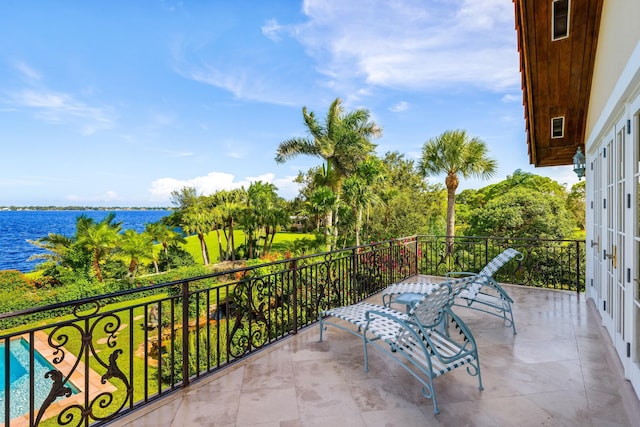 balcony featuring a water view