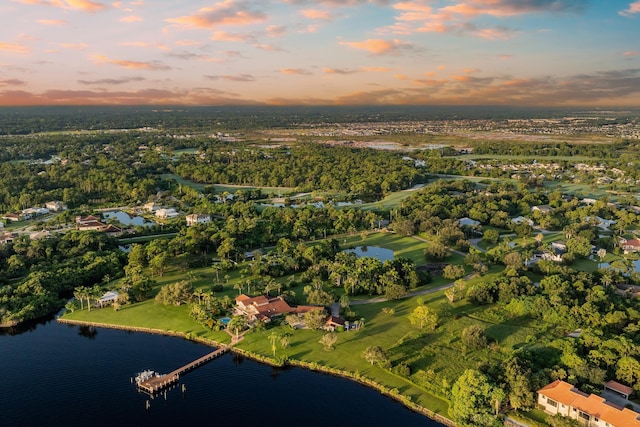 aerial view at dusk with a water view