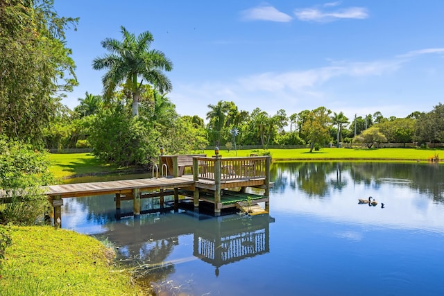 dock area featuring a yard and a water view