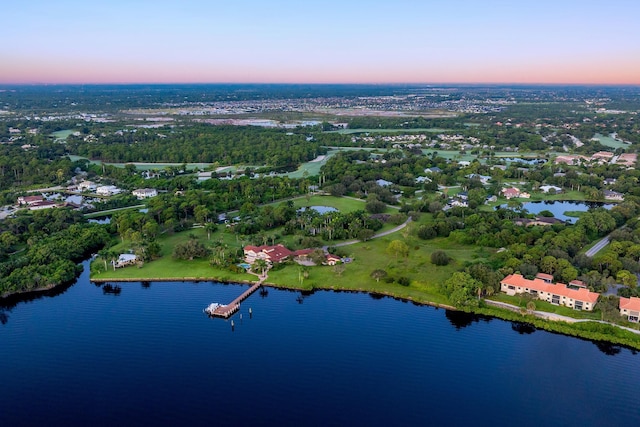 aerial view at dusk with a water view