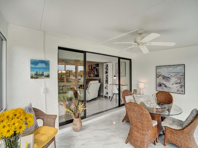 dining room featuring ceiling fan