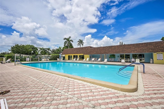 view of swimming pool featuring a patio area