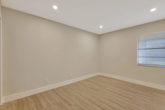 spare room with light wood-type flooring