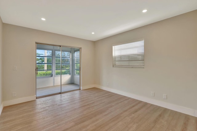 unfurnished room featuring light wood-type flooring